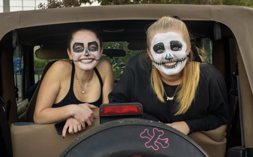 Seniors Riley Alves and Ashly Henry dressed as skeletons during the schools Trunk or Treat event on Oct. 28.