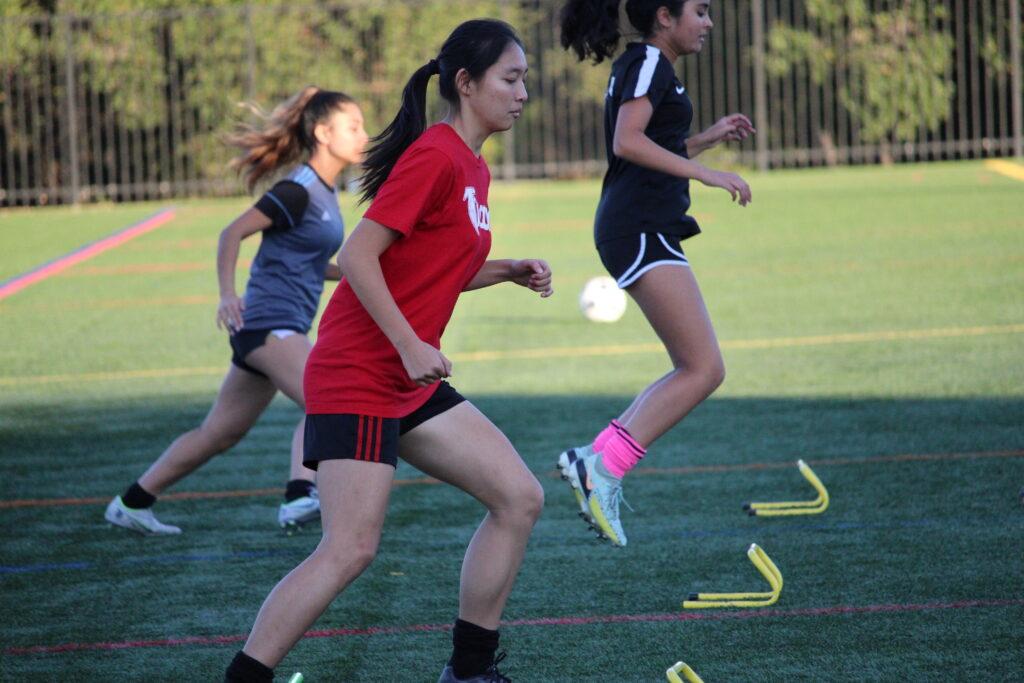 Senior Jiah Jung does a simple drill during tryouts. 