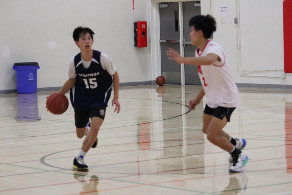 Junior+Caleb+Yu+practices+drills+with+senior+Bryan+Wang+during+an+open+gym+session+in+preparation+for+the+season.
