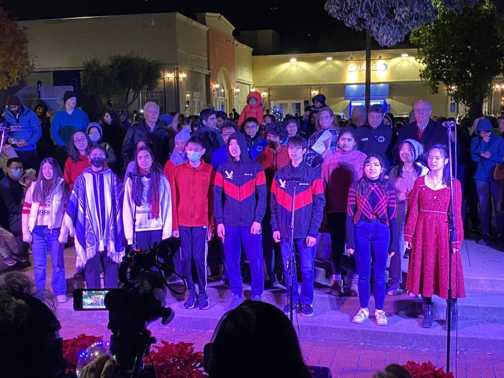 Surrounded by family and friends, the Chamber Choir sings for the community at Blaney Plaza.