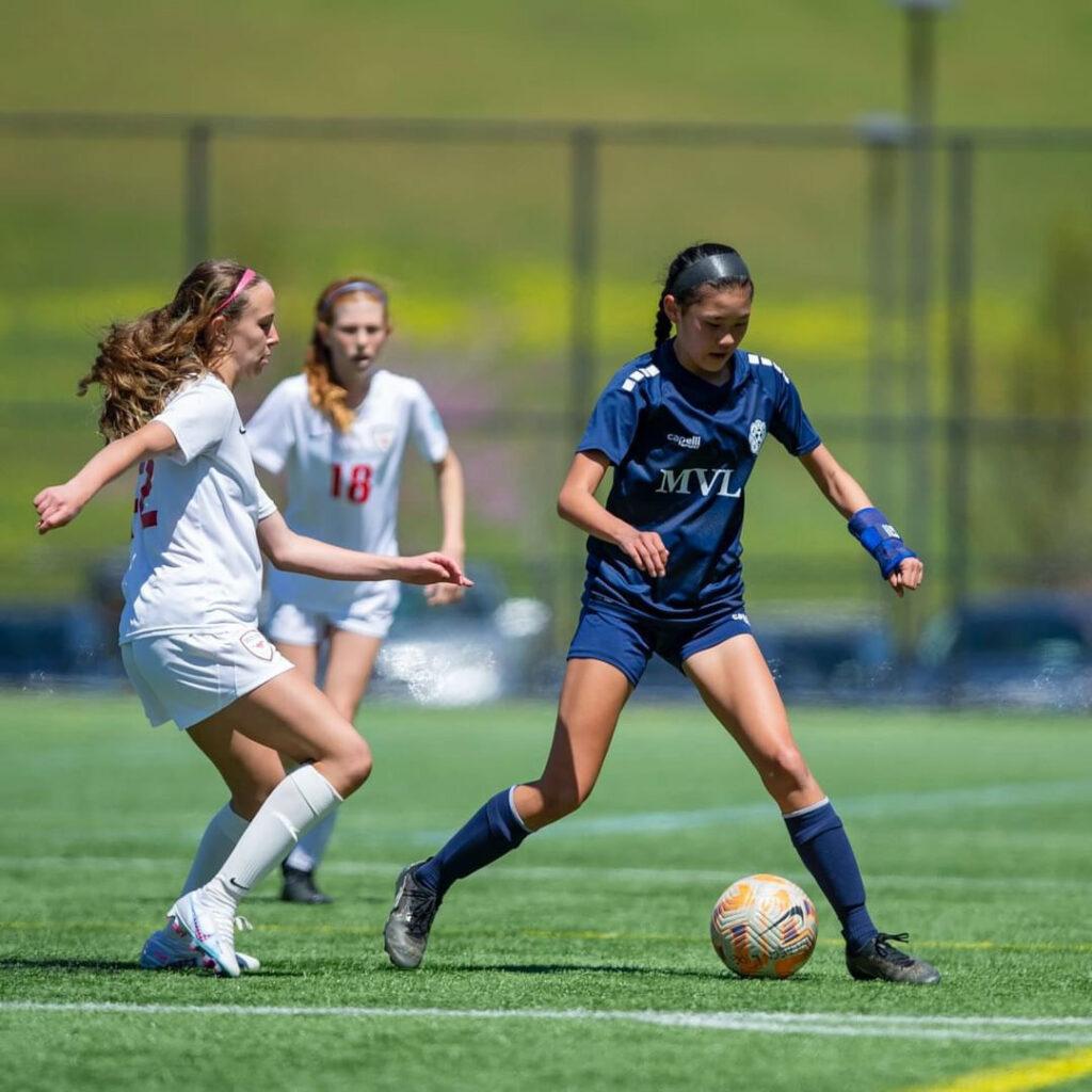 Katie Lu dribbles the ball during a game against Mustang Soccer Club at Provident Field on Apr. 15.