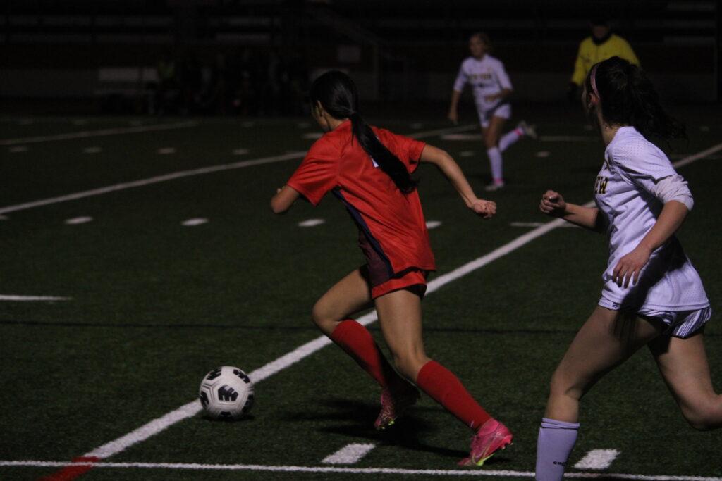 Junior Hilary Gonzalez gains possession of the ball on Jan. 16 during a game against Mountain View.