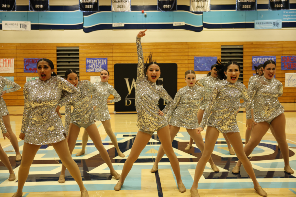 Senior Michelle Wan fiercely raises her right arm during the ending pose of the team’s jazz routine during the competition hosted by West Coast Elite at Valley Christian on Jan. 20.
