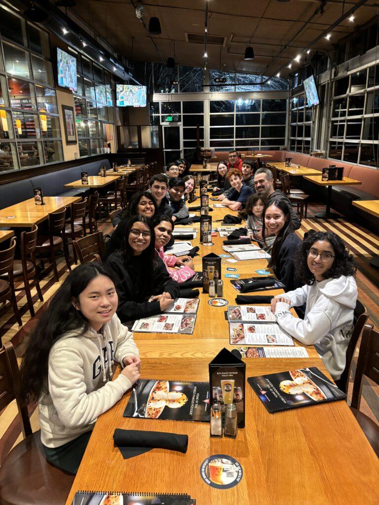 The Mock Trial team smiles cheerfully, celebrating their season with a dinner at BJ’s, an end of season club tradition. 