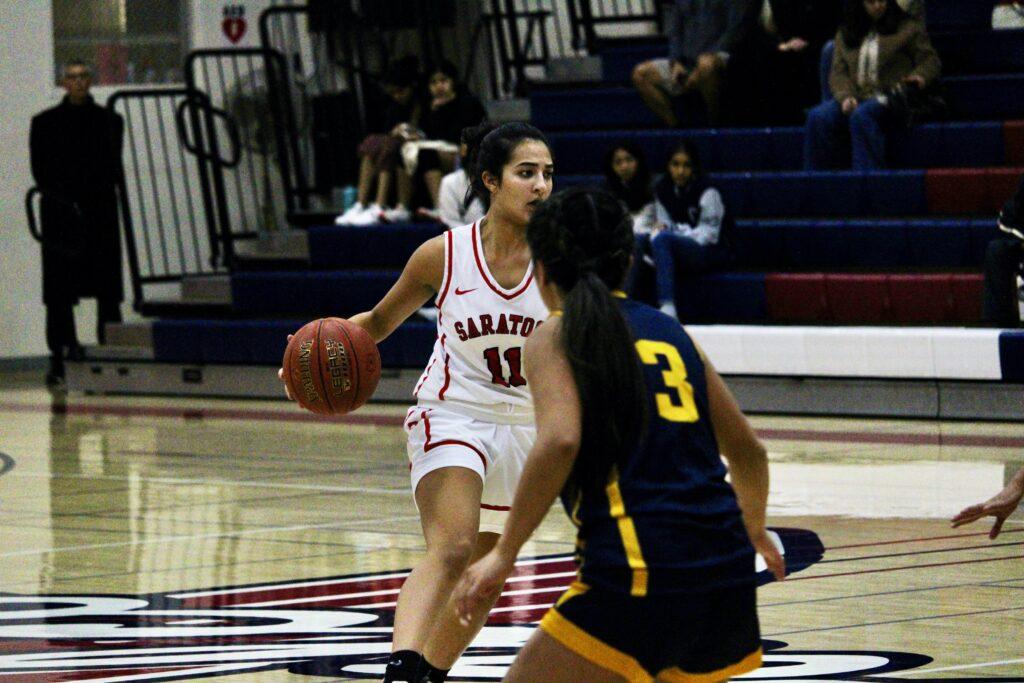 Senior Zinnerah Ahmed rushes forward to score a layout against Mountain View on Jan. 24.