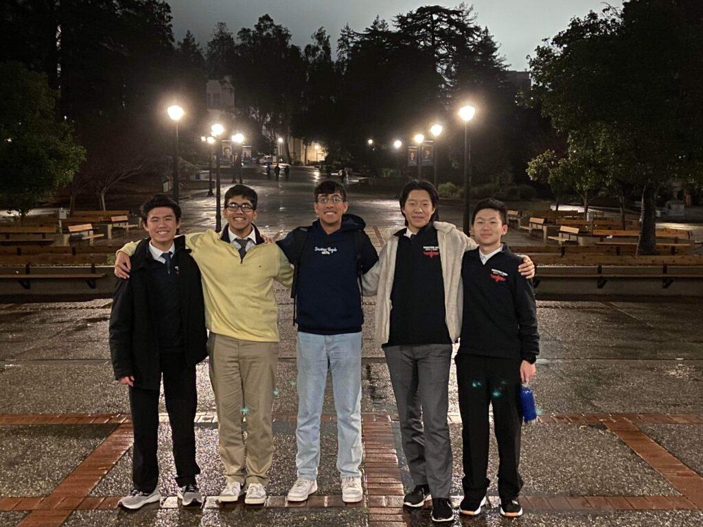 Sophomore Jet Tsang, junior Ashish Goswami, alumnus Arnav Garg, sophomore Anthony Luo and junior Leonardo Jia stand outside Dwinelle Hall in Berkeley. 