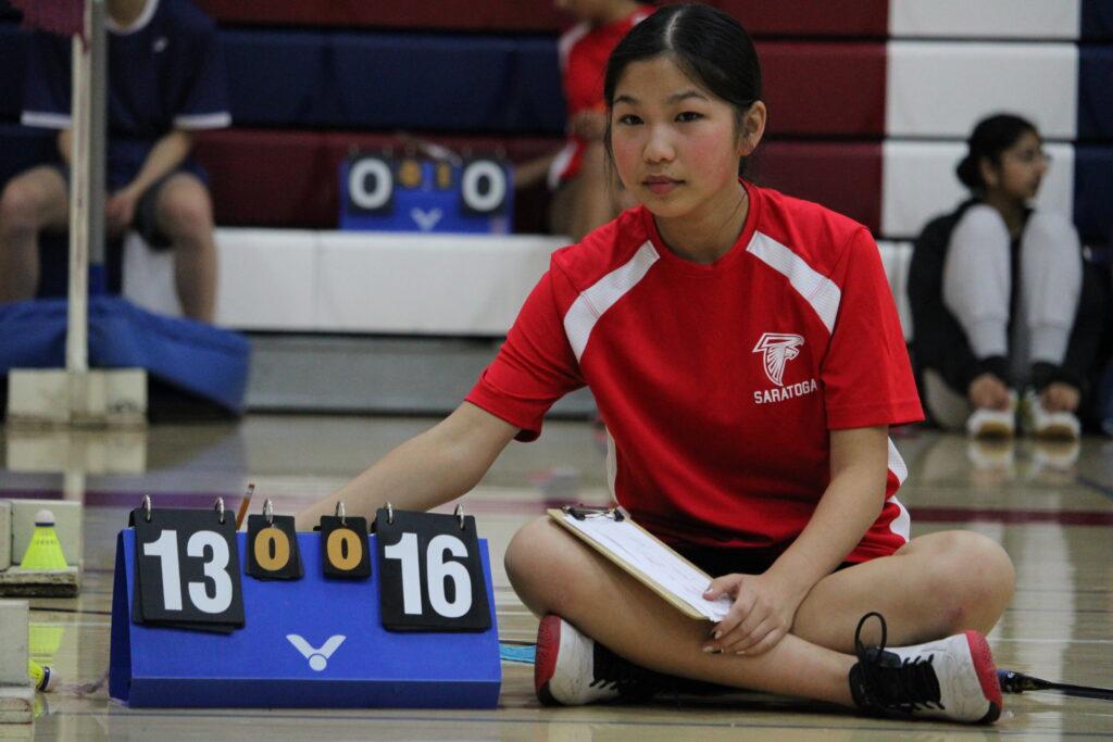 Sophomore Eliza Lin keeps score during a match.
