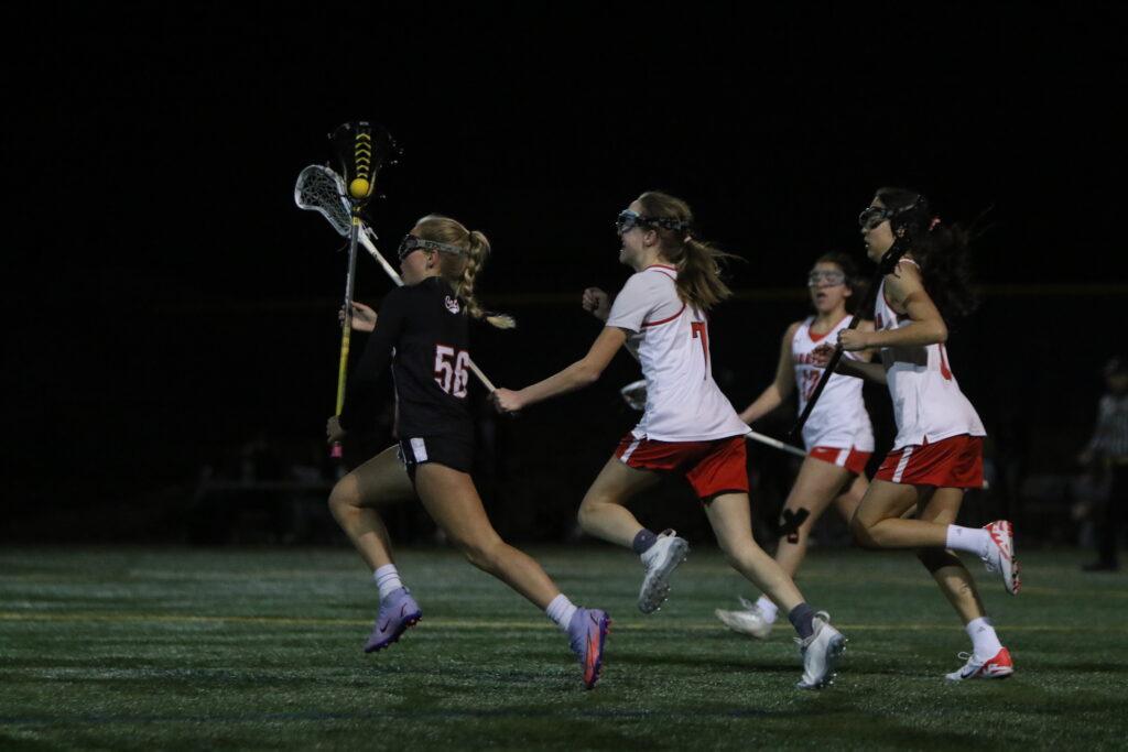Sophia Farone sprints after the ball during the girls lacrosse game against Los Gatos. 