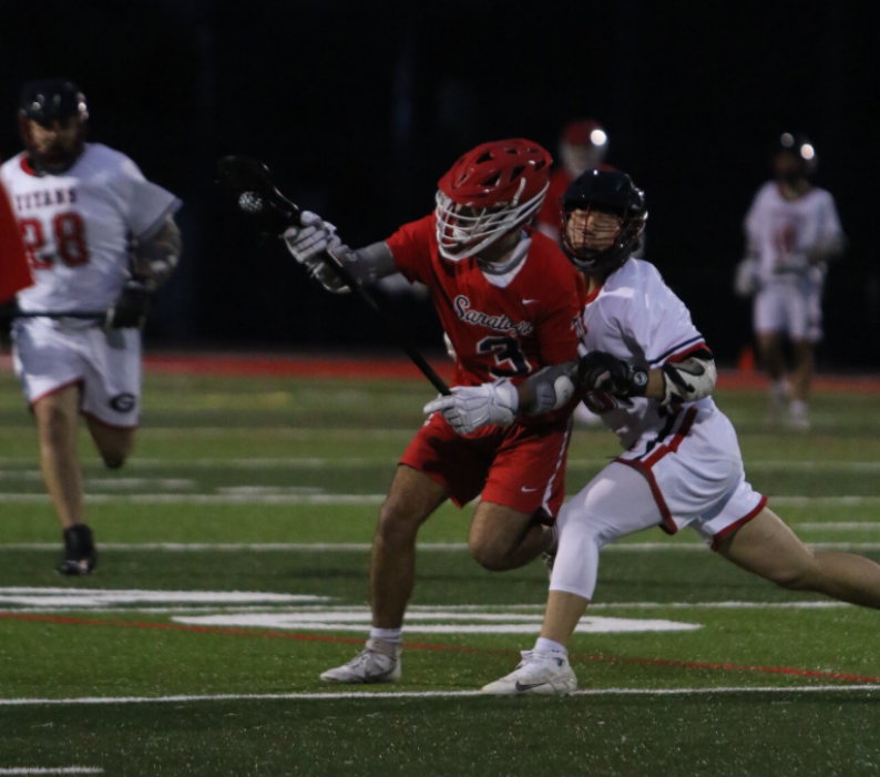 Senior+Cooper+Call+lowers+his+shoulder+into+Pacific+grove+defender