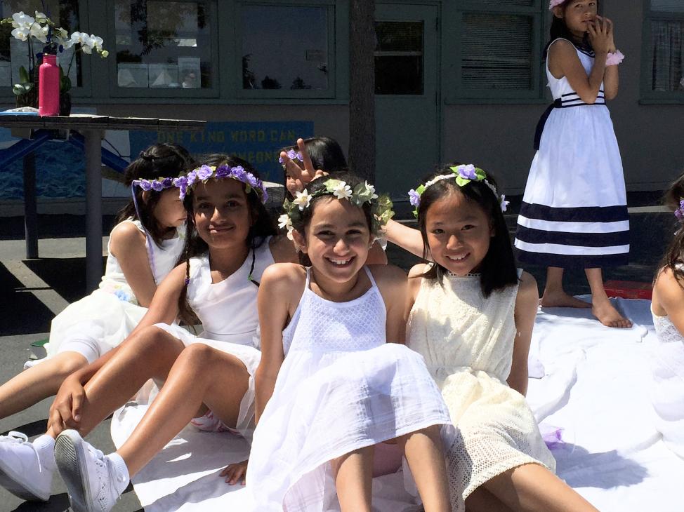 Me with my best friends, now-juniors Juhi Karamcheti and Beverly Xu, during the May Day Parade in 3rd grade, 2016.