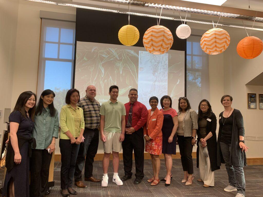 After the first exhibition in 2023, senior Ryan Lin poses with LGSUHSD and Saratoga Library staff. 
