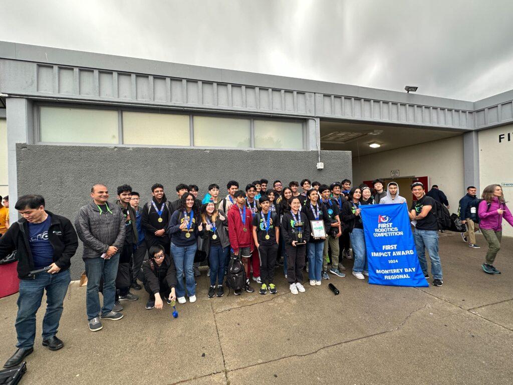 The MSET Fish proudly hold their victory banner outside of Seaside High School in Monterey, California after winning the Regional Impact Award on March 31. 