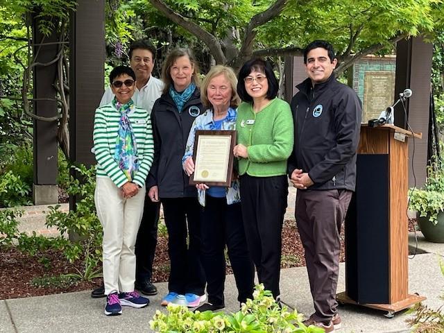 Council members Tina Walia, Chuck Page, Kookie Fitzsimmons; Saratoga Foothill Club President Nancy Miller; Mayor Yan Zhao and Vice Mayor Belal Aftab (left to right) pose with the Tree City USA award.