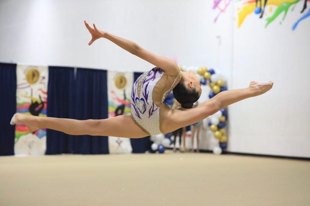 Ece Guvener leaps into a split during one of her competitions
