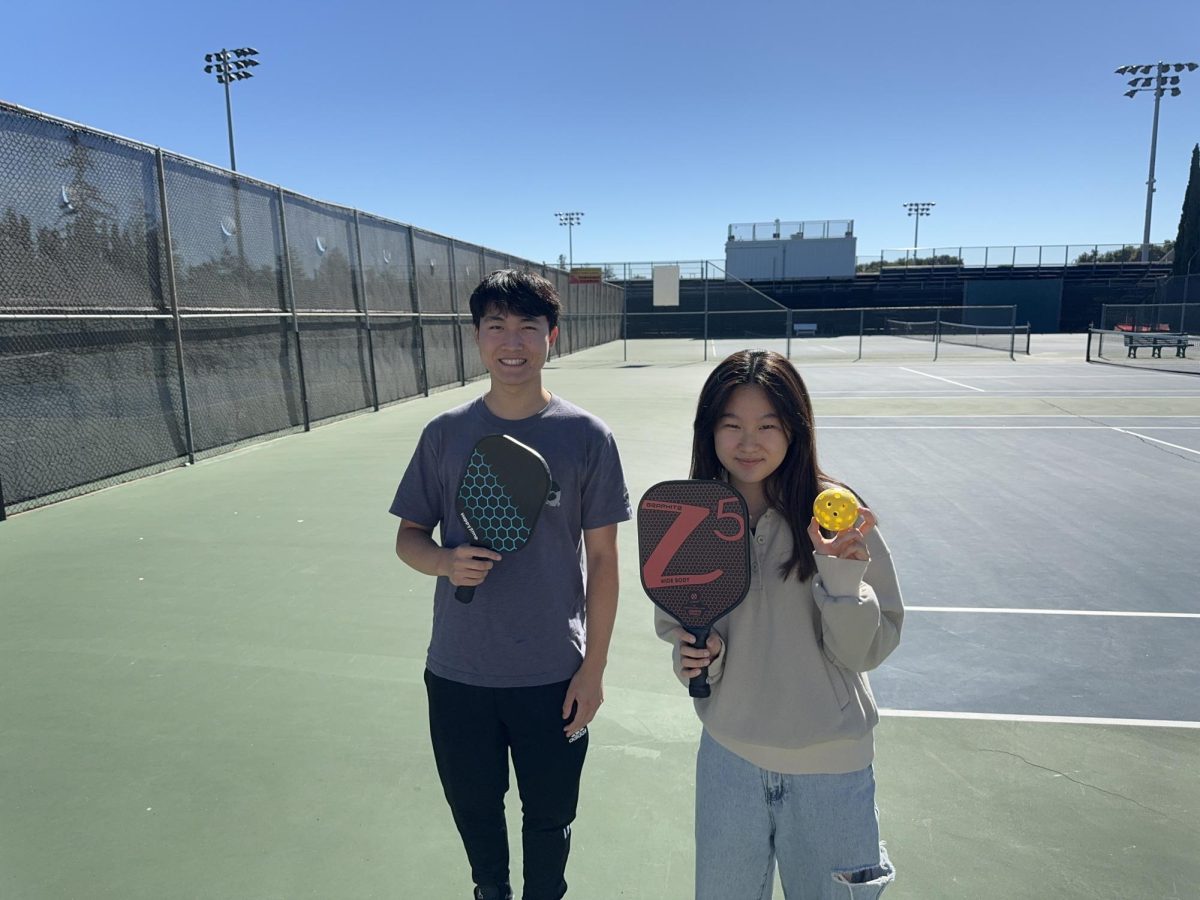 Zack trying pickleball for the first time with Sunny.