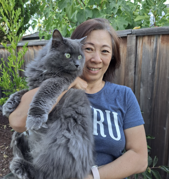 Jean Hsu, pictured holding up her cat Dreamer, will be replacing Robert Wise as the new registrar.