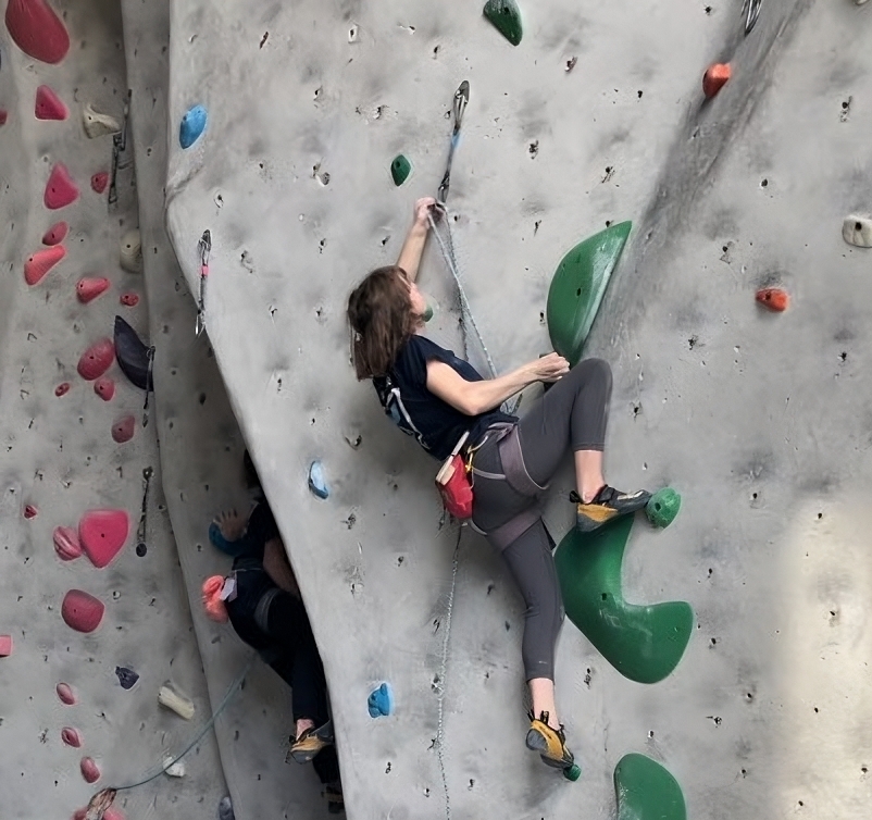 Sadie climbing at a Qualification Event (QE) competition, at Metal Mark in Fresno