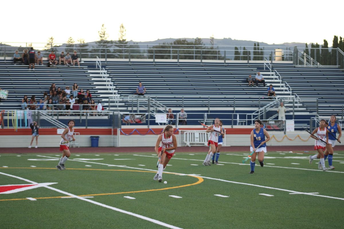 In last year’s matchup with Santa Clara, senior Sydney Riera controls the game from the middle of the field. 