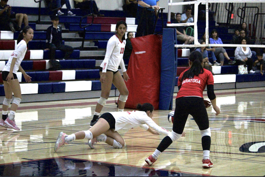 Freshman Chloe Zeng dives to narrowly save the ball during a game against Milpitas on Sept. 17.