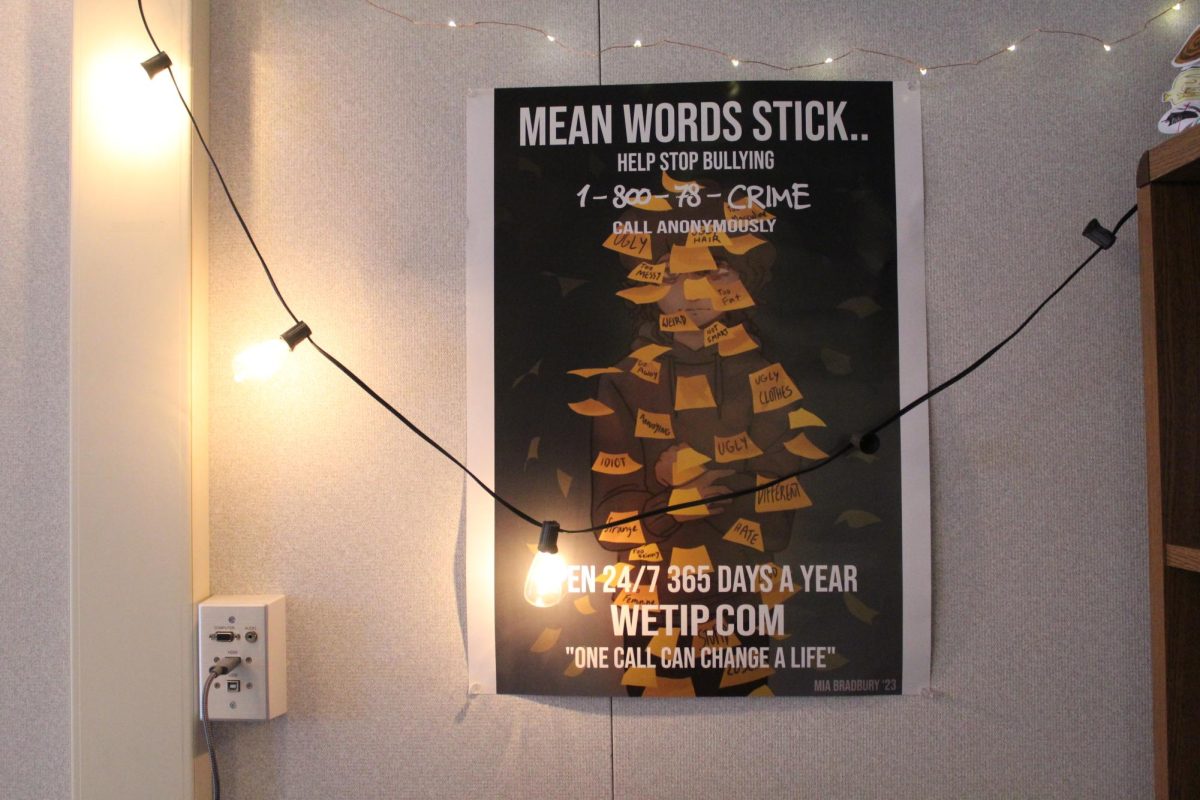 An example of a WeTip poster depicting the impact of negative comments hangs in Meghan Laws’ English classroom.