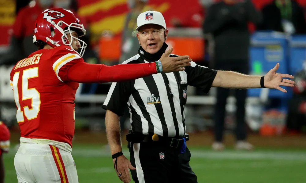 A NFL referee in a Chiefs’ style ref jersey.