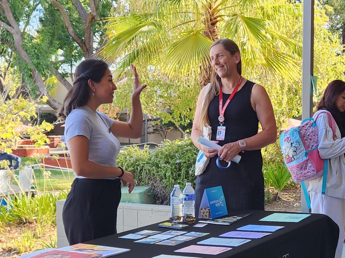 Ward talks to a representative from Hult International Business School as part of a college fair on Sept. 23