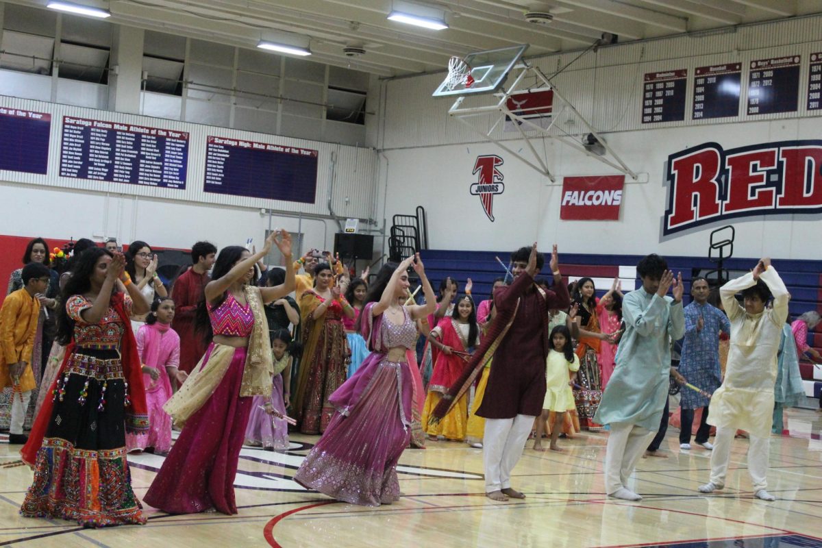 ICAC members lead the crowd through the dance, teaching participants and helping everyone enjoy the celebration together.