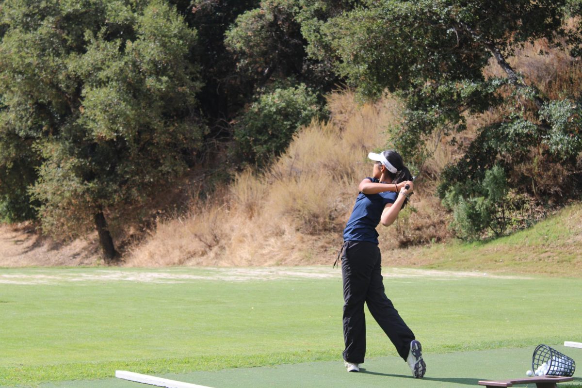 Senior Sarah Lim practices her swing at the Saratoga Country Club range.
