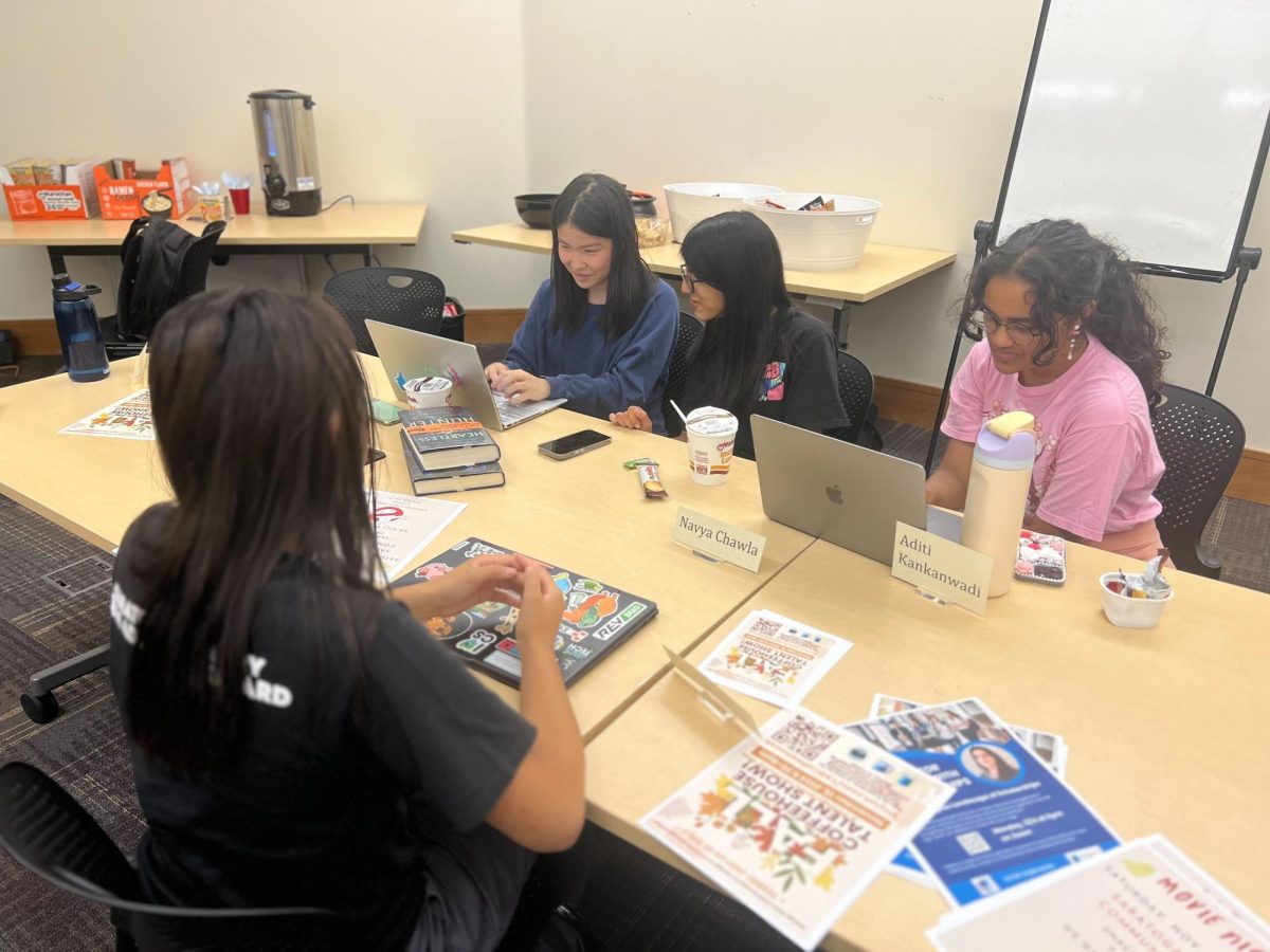 TAB creative arts committee reviews submissions for The Butterfly Effect magazine.