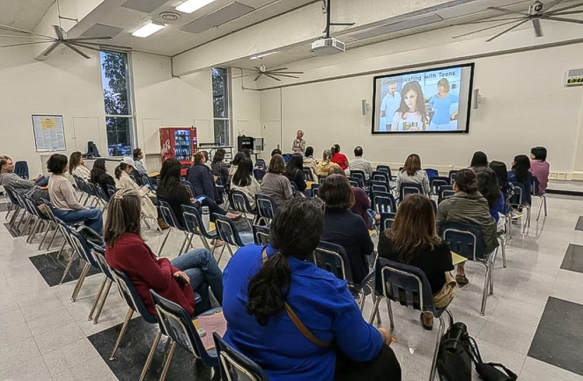 Parents listen attentively to life coach Mary Eschen as she discusses several valuable topics.
