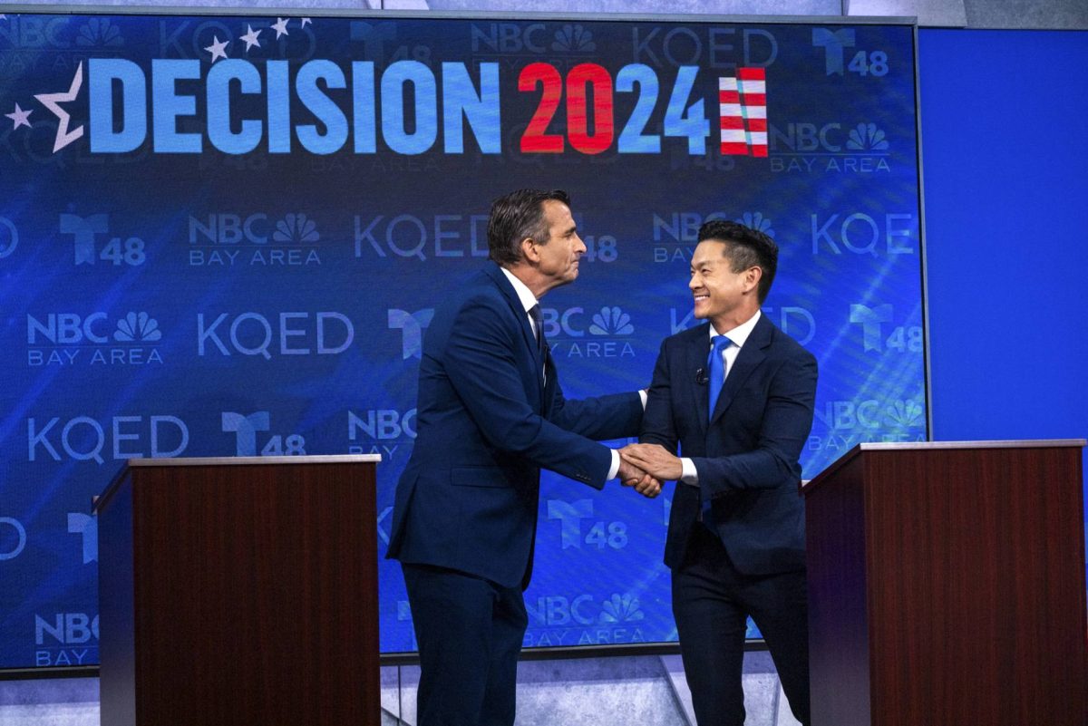 Liccardo (left) and Low (right) shake hands after debating a variety of issues on Oct. 11.