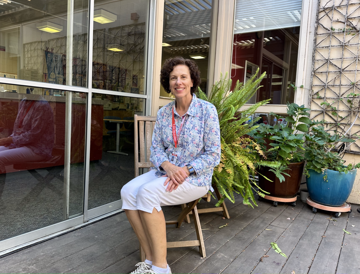 New Guidance Counselor Mary Carol Bernal sits inside the office atrium.