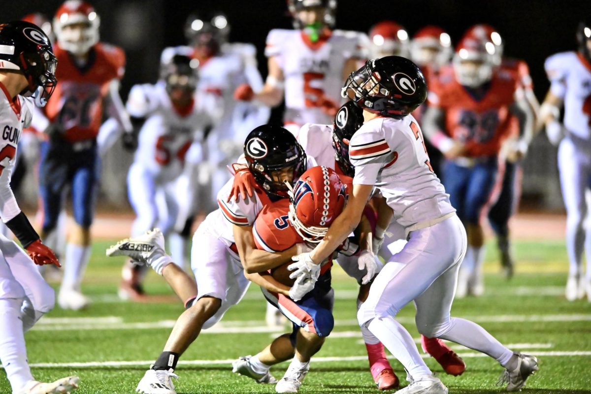 Receiver Sawyer Chao driving through Gunn’s defense.