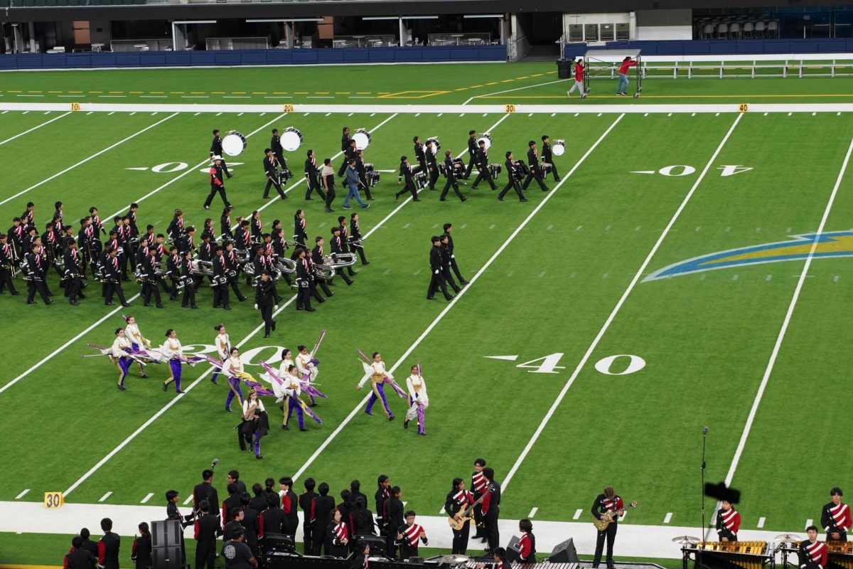 The marching band and color guard take the field for their final performance of their 2024 field show, “The Show Must Go On.”