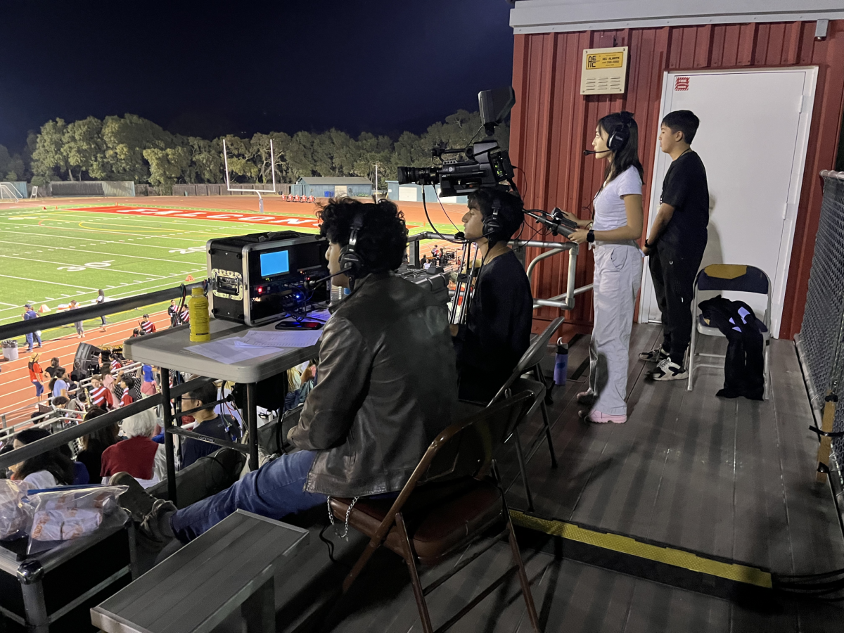 Seniors Saatvik Kommareddi and Gautham Jasti act as commentators for the Nov. 1 football game.
