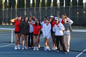 The girls’ tennis team poses for a group photo.
