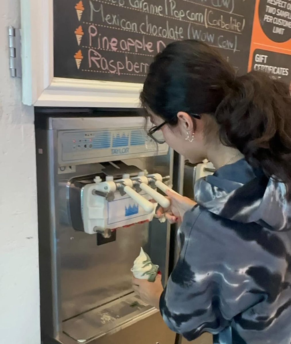 Senior Natalie Zaragoza tops off an ice cream cone.
