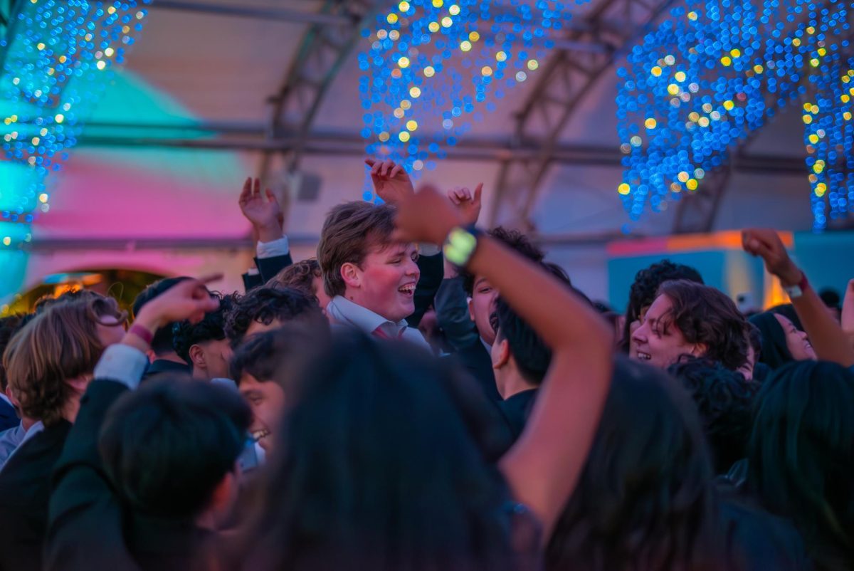 Students dance to the music in the moshpit on Dec. 7.
