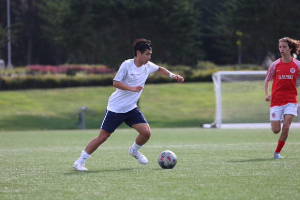 Silicon Valley Soccer U17 Player Langdon Huynh dribbling to goal.