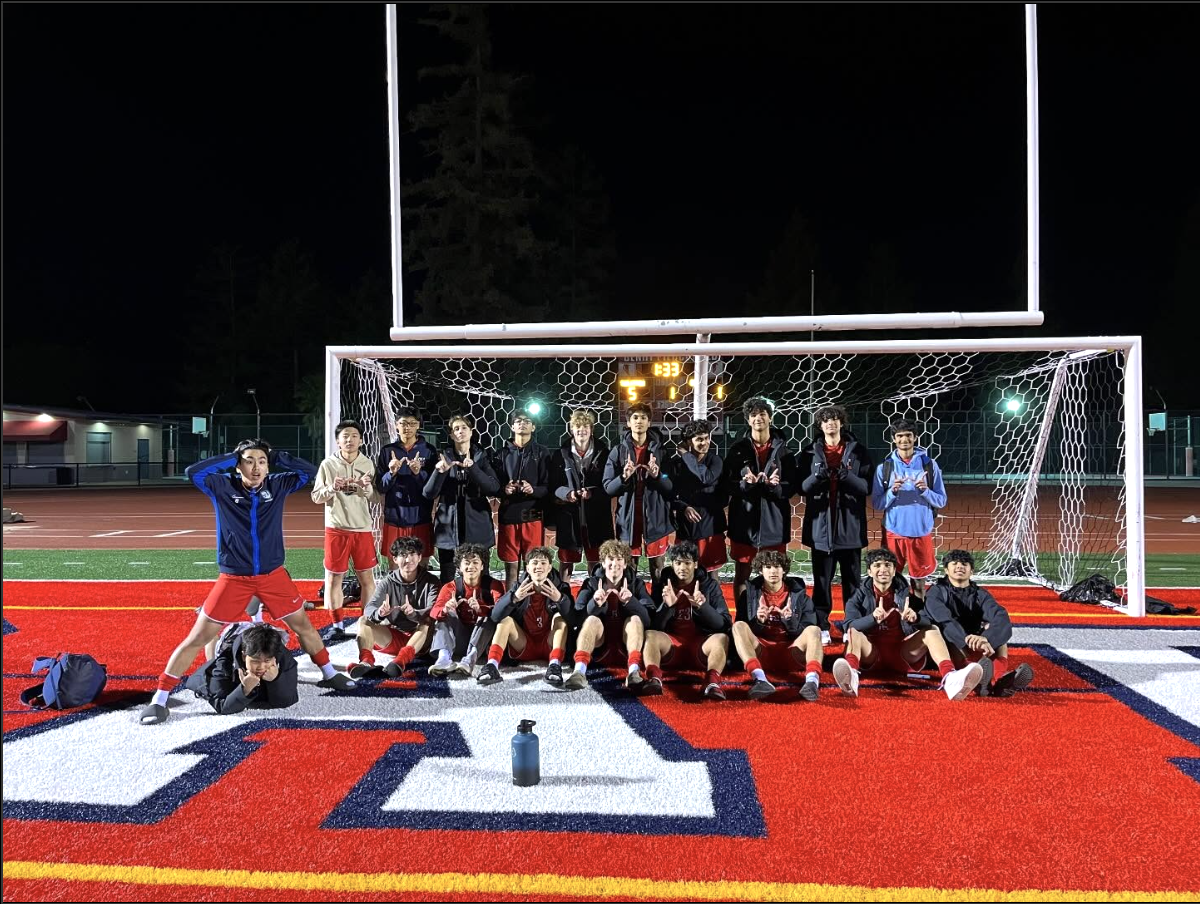 The team poses for a picture on Jan. 16 after a home victory against MacDonald.