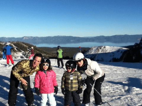 The Gechlik family poses for a photo at the top of a ski slope in 2013.
