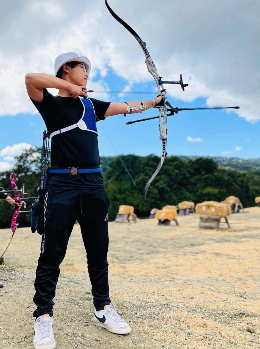 Senior David Kim practices archery at the Stevens Creek County Park Archery Range.