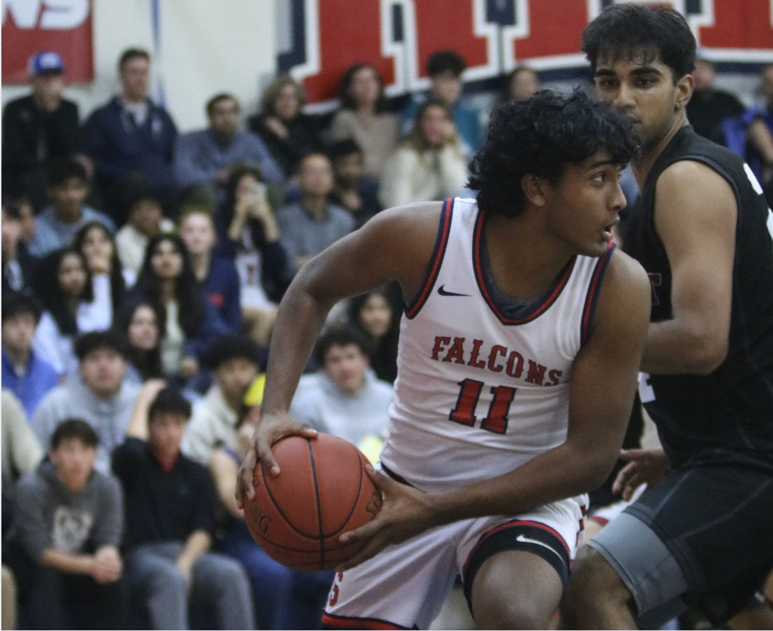 Senior Saatvik Kommareddi spins past a defender at a game on Jan. 18.