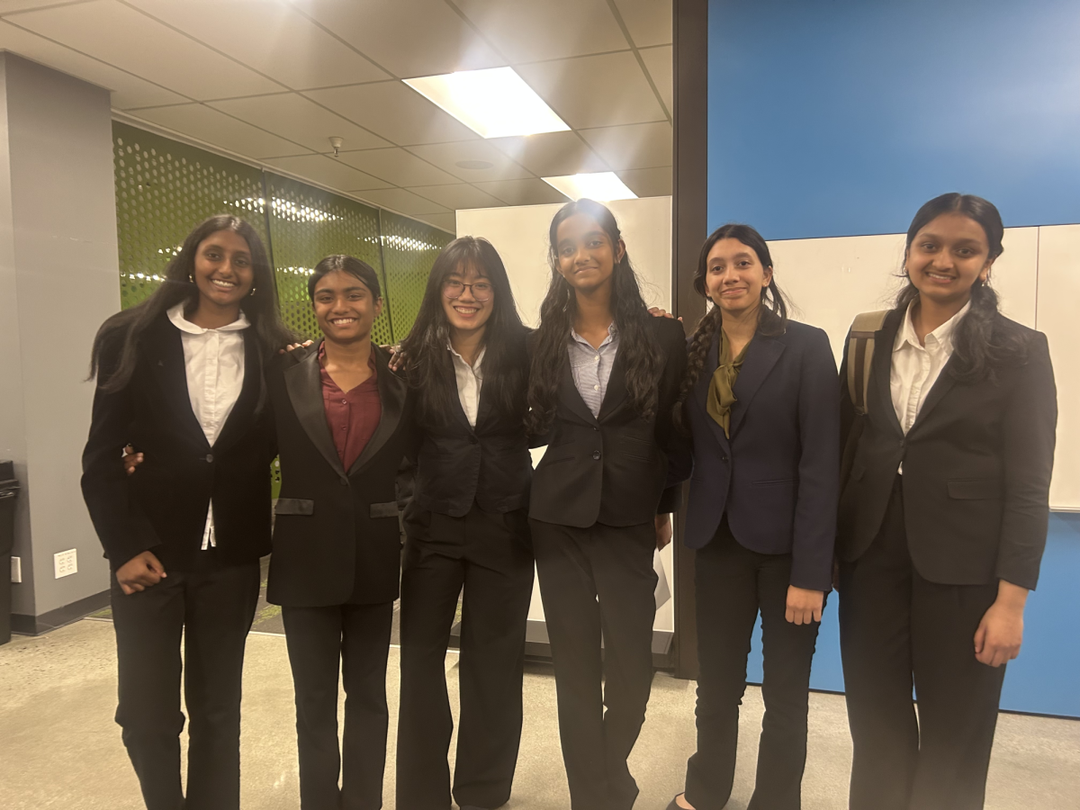 Members of the prosecution and defense team pose for a photo after winning their rounds.