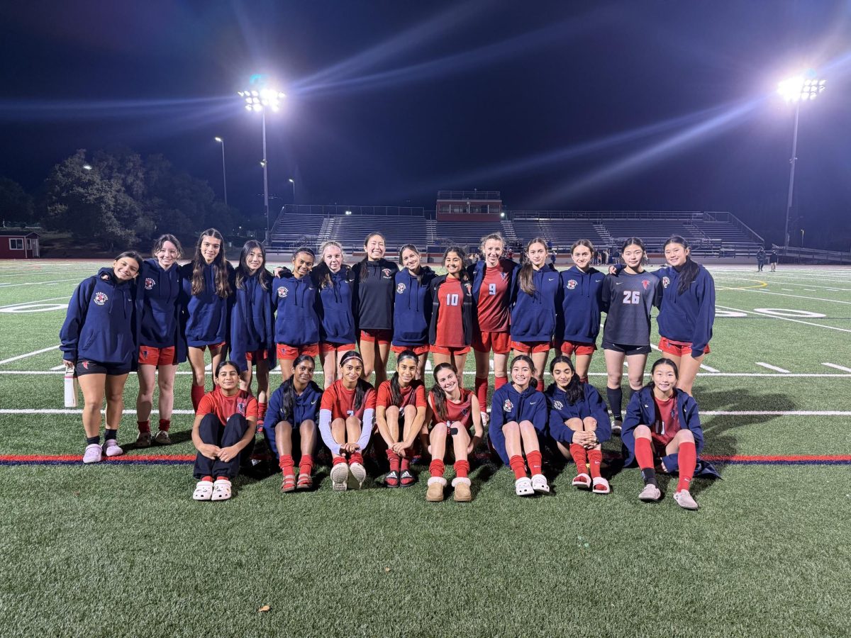 Team posing for a picture after a win at home.