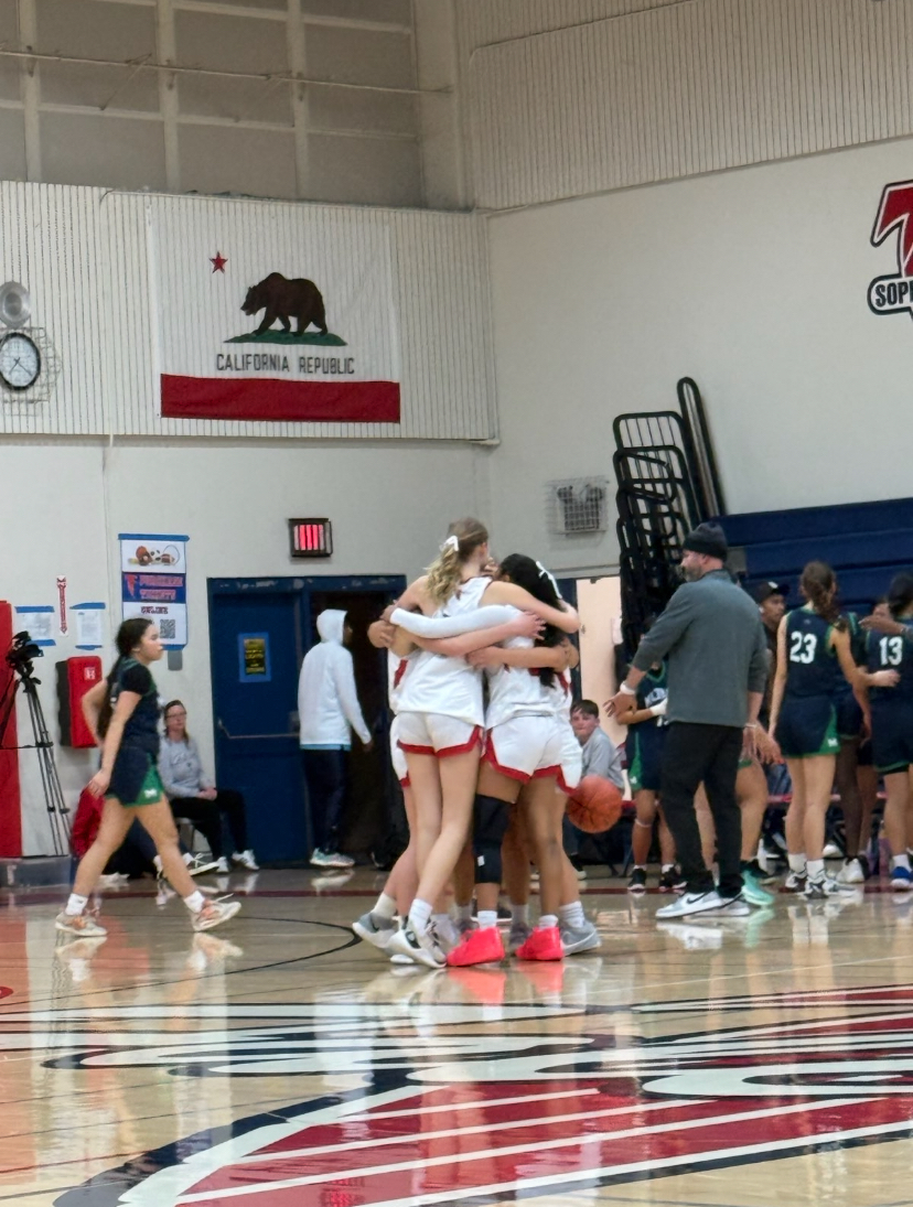 After an emotional win, the 6 graduating seniors shared a hug after the game. 