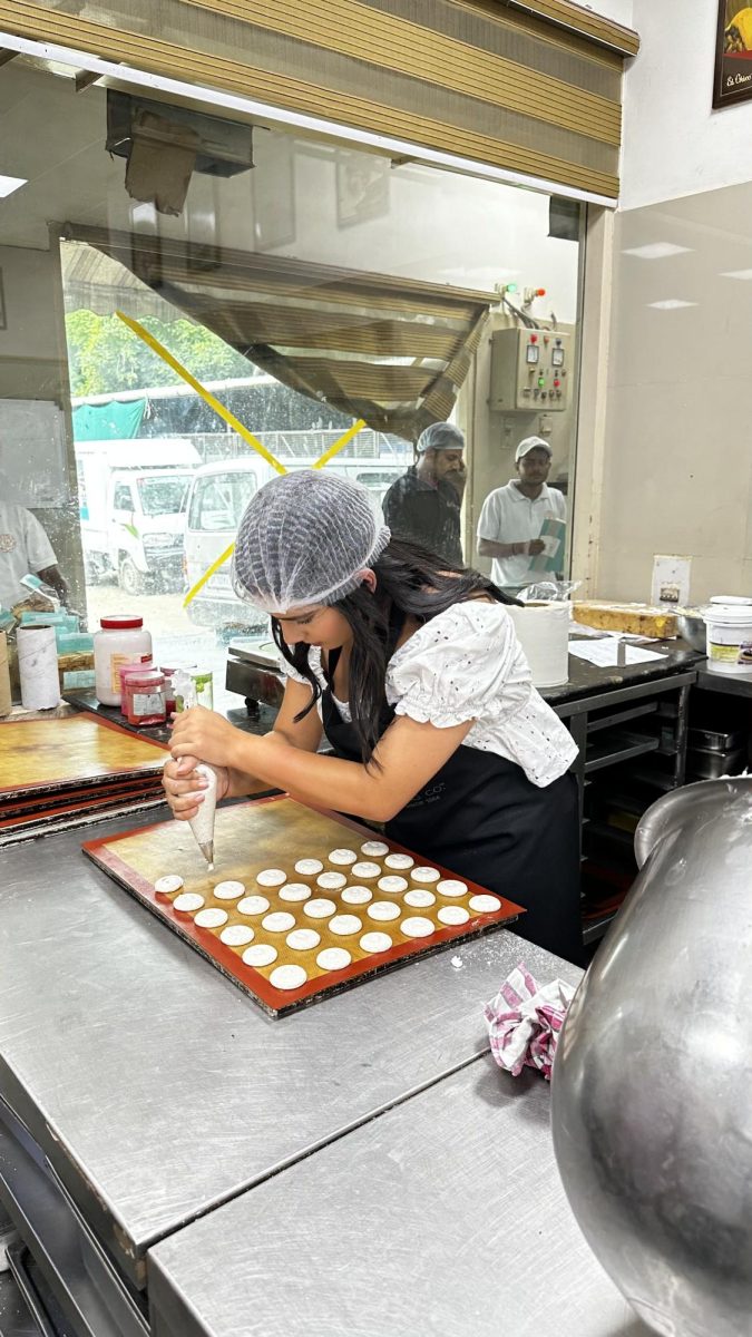 Chowdri ices macaroons at El Chico in Prayaraj, India.
