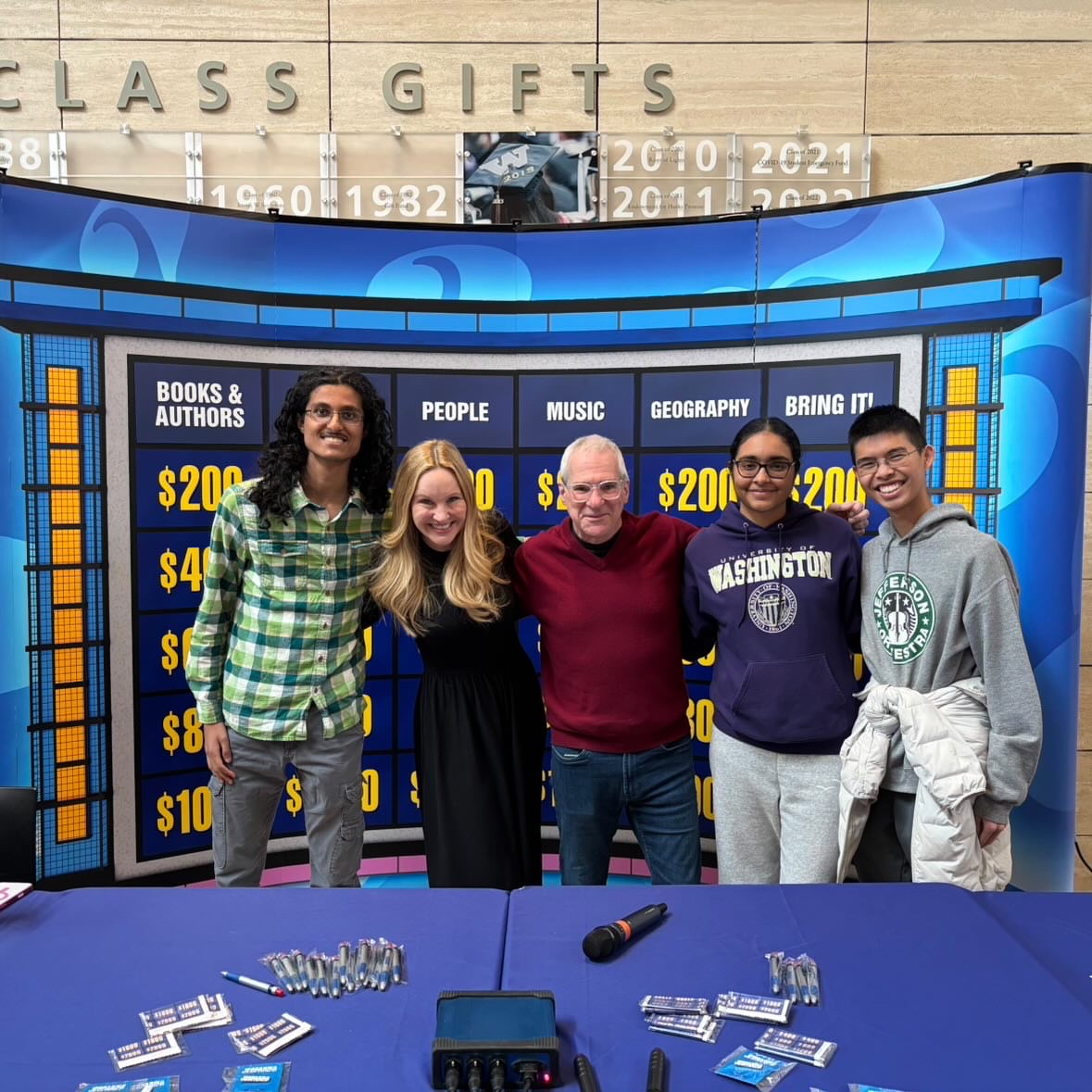 Ahuja (middle right) and her college teammates meeting “Jeopardy!” TV show legend, Sam Buttrey, at a student union pop up.