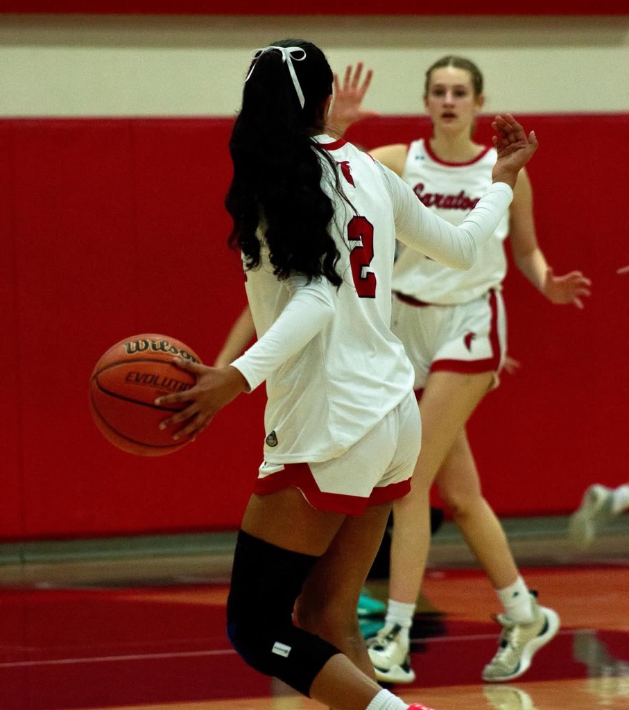 During the Senior Night game against MacDonald at home, senior Urvi Iyer gestures for a screen from senior Riley Adler.