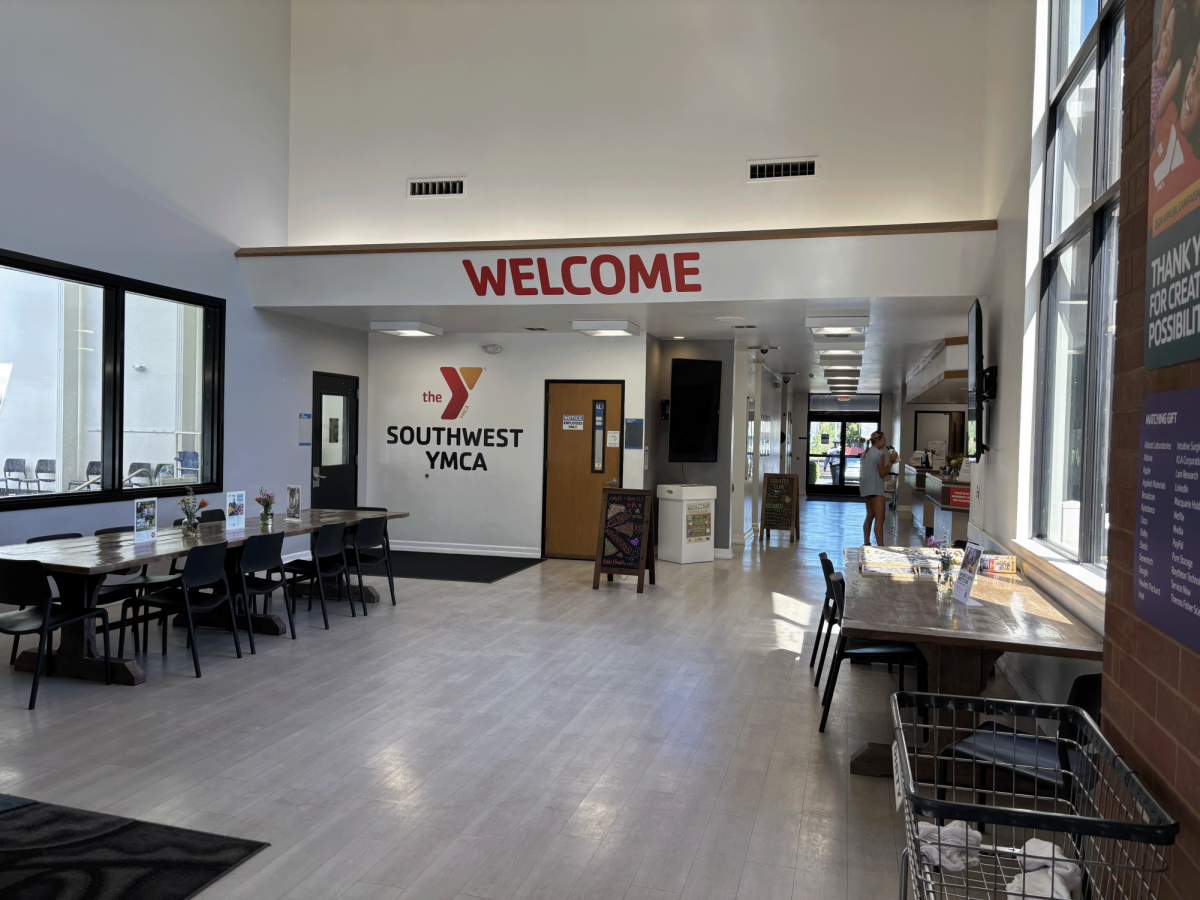 The entrance to the YMCA, located off of Quito Rd.,  displays the front desk and pool.